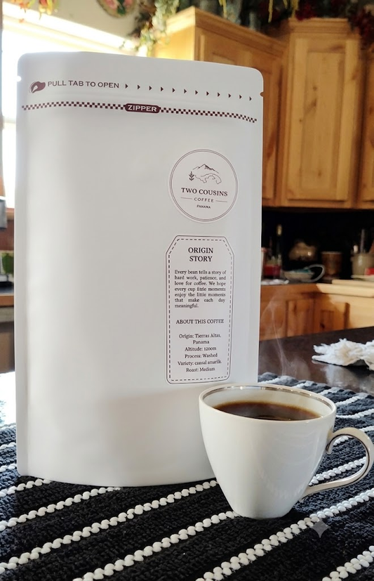 Two Cousins Coffee Panama white coffee bag with readable labels and a cup of coffee